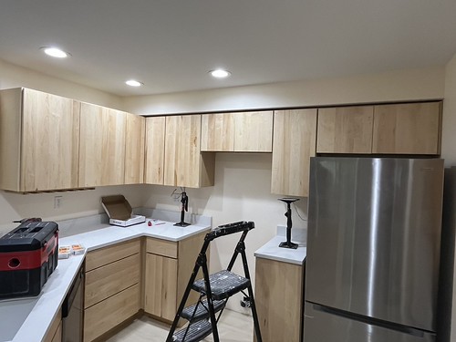 Cabinets installed in a condo with wood finish