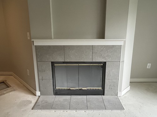 Fireplace with tile and MDF mantle piece above