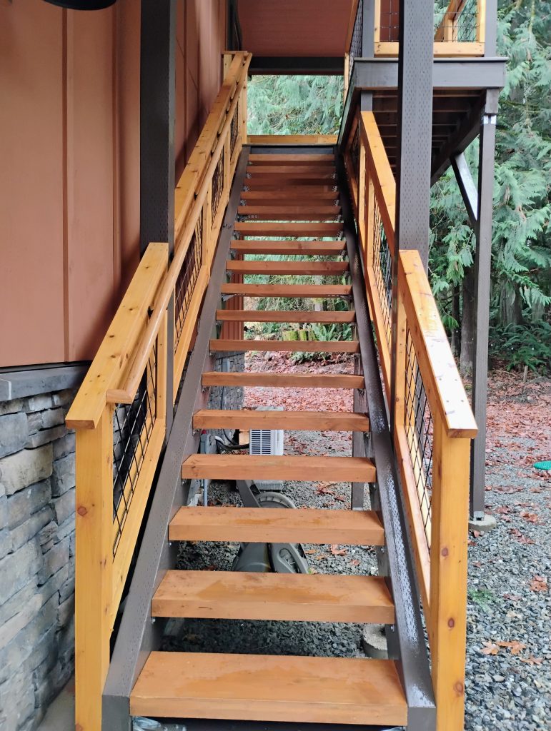 Cedar stairs leading up to the loft Area of an adu. stained and finished